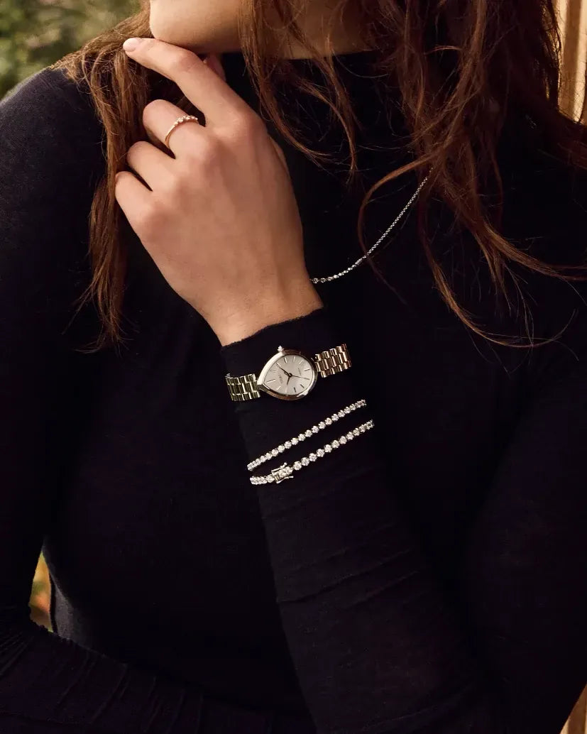 EM1200-55A watch with a 26 × 31mm case worn on a wrist
