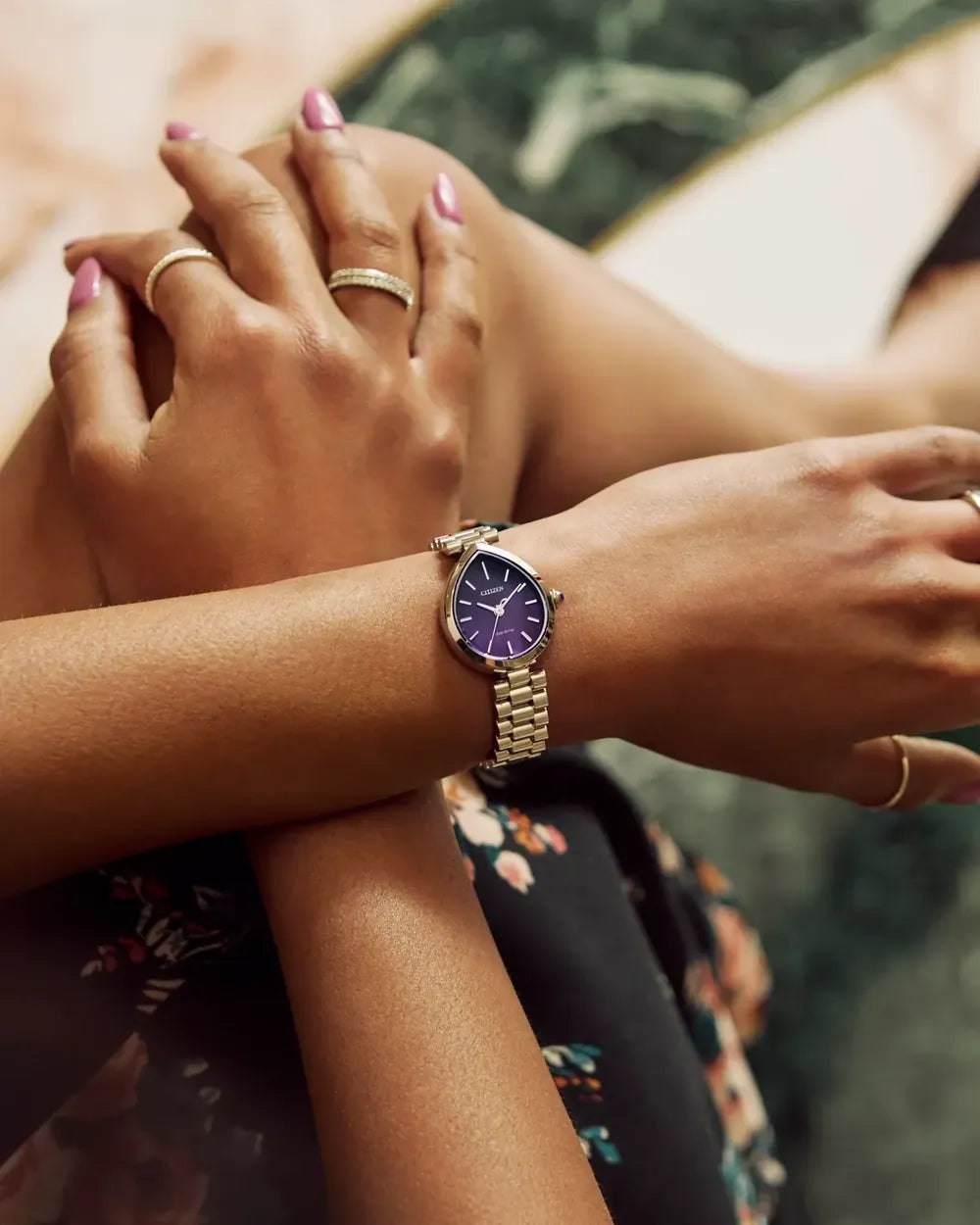 EM1200-55X watch with a 26 × 31mm case worn on a wrist