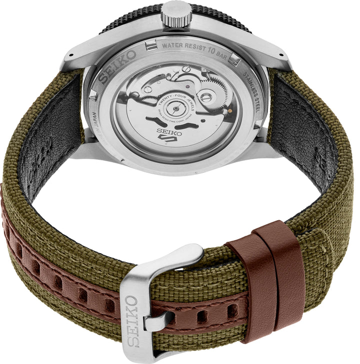 Seiko HDB008 exhibition caseback showing the automatic movement, khaki nylon strap, leather keepers and buckle