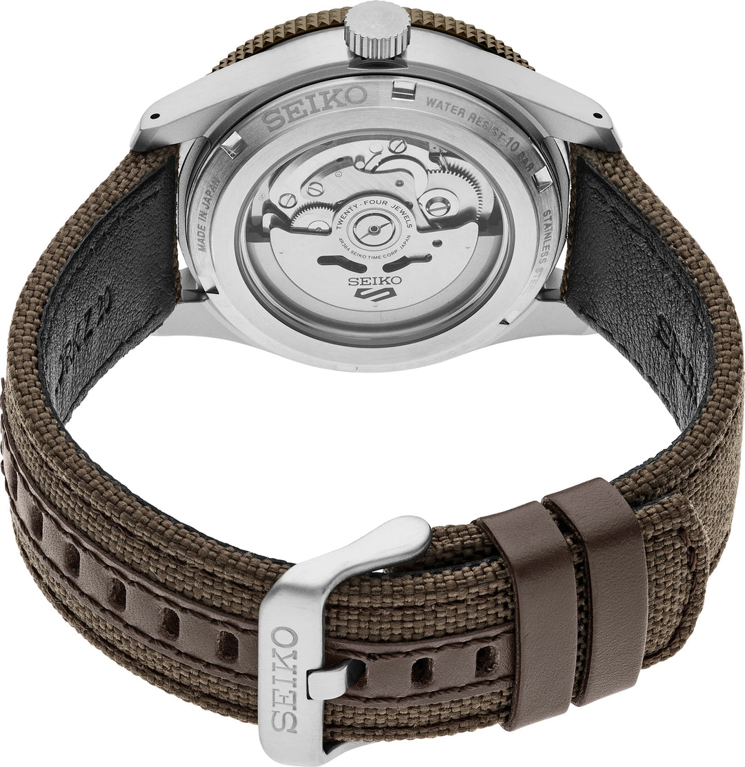 Seiko HDB009 exhibition caseback showing the automatic movement, brown nylon strap, leather keepers and buckle