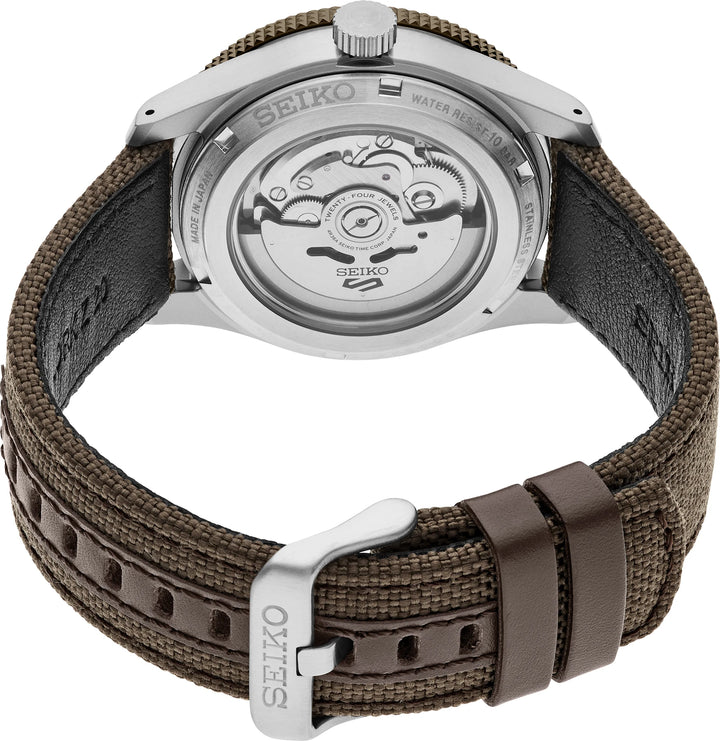 Seiko HDB009 exhibition caseback showing the automatic movement, brown nylon strap, leather keepers and buckle