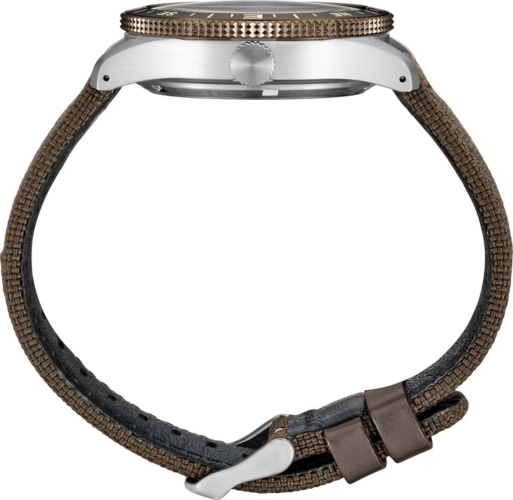Seiko HDB009 side profile showing the steel case, crown, brown compass bezel and nylon strap with leather details