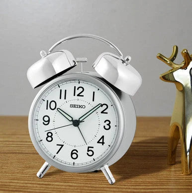 Seiko QHK063SLH silver-tone twin bell alarm clock styled on a tabletop