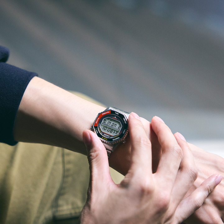 Seiko SMGG19 red-bezel Rotocall digital watch worn on the wrist
