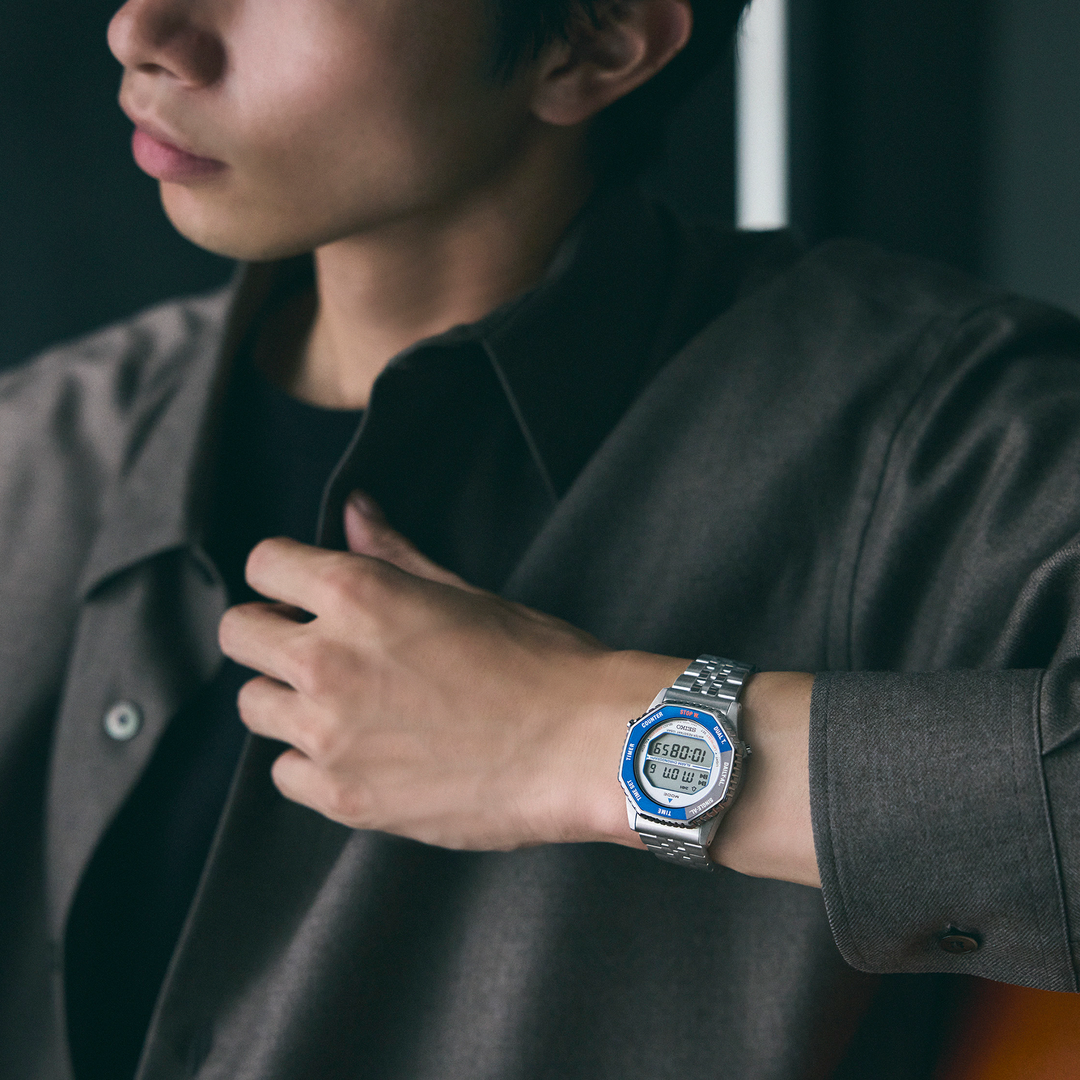 Seiko SMGG21 blue-bezel Rotocall digital watch worn on the wrist