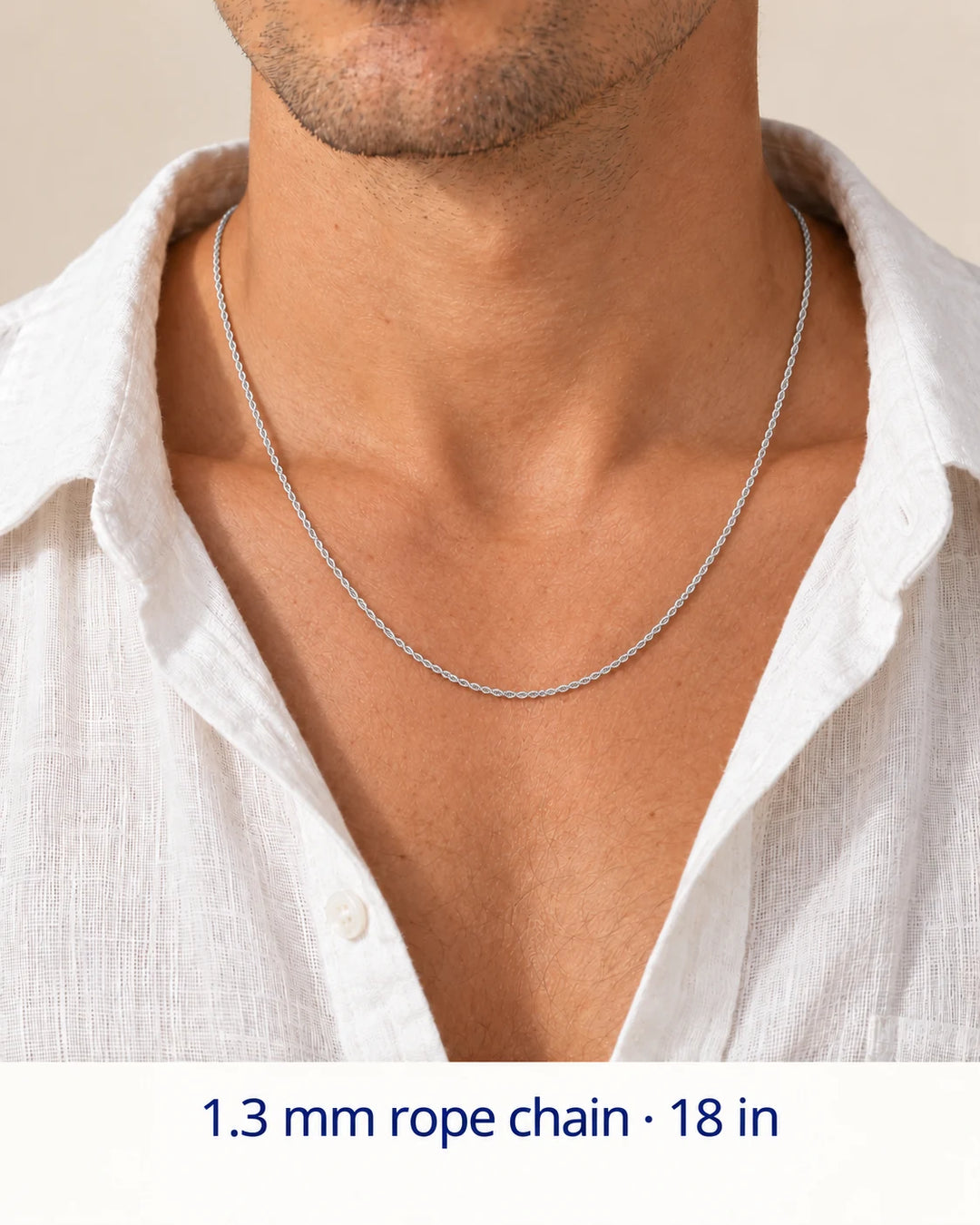 Men's styling view of a 1.3 mm sterling silver rope chain necklace, shown at an 18-inch example length.