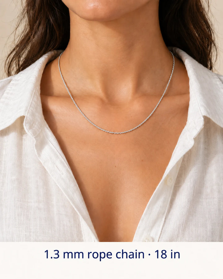 Women's styling view of a 1.3 mm sterling silver rope chain necklace, shown at an 18-inch example length.