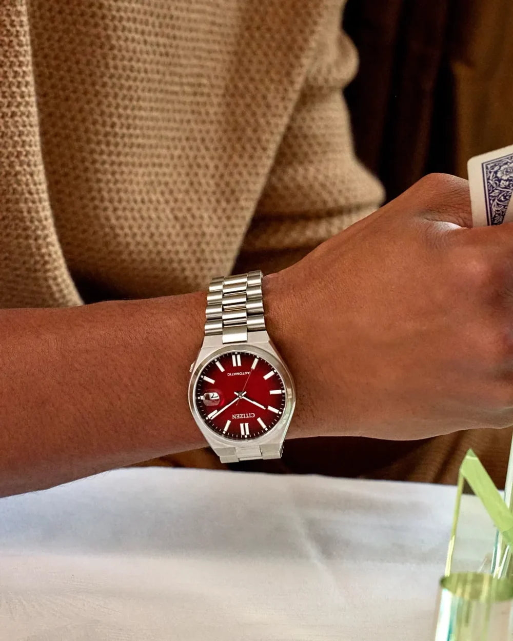 NJ0150-56W watch with a 40mm case worn on a wrist